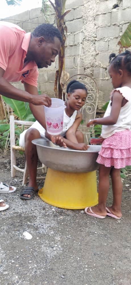 Frantz and family worship in Haiti